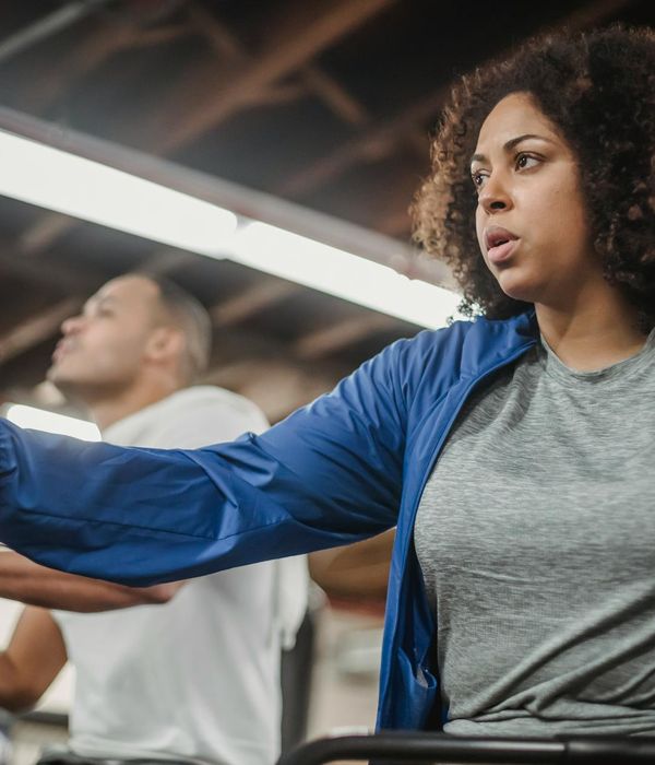 Person practicing smooth rhythmic cardio movements indoors
